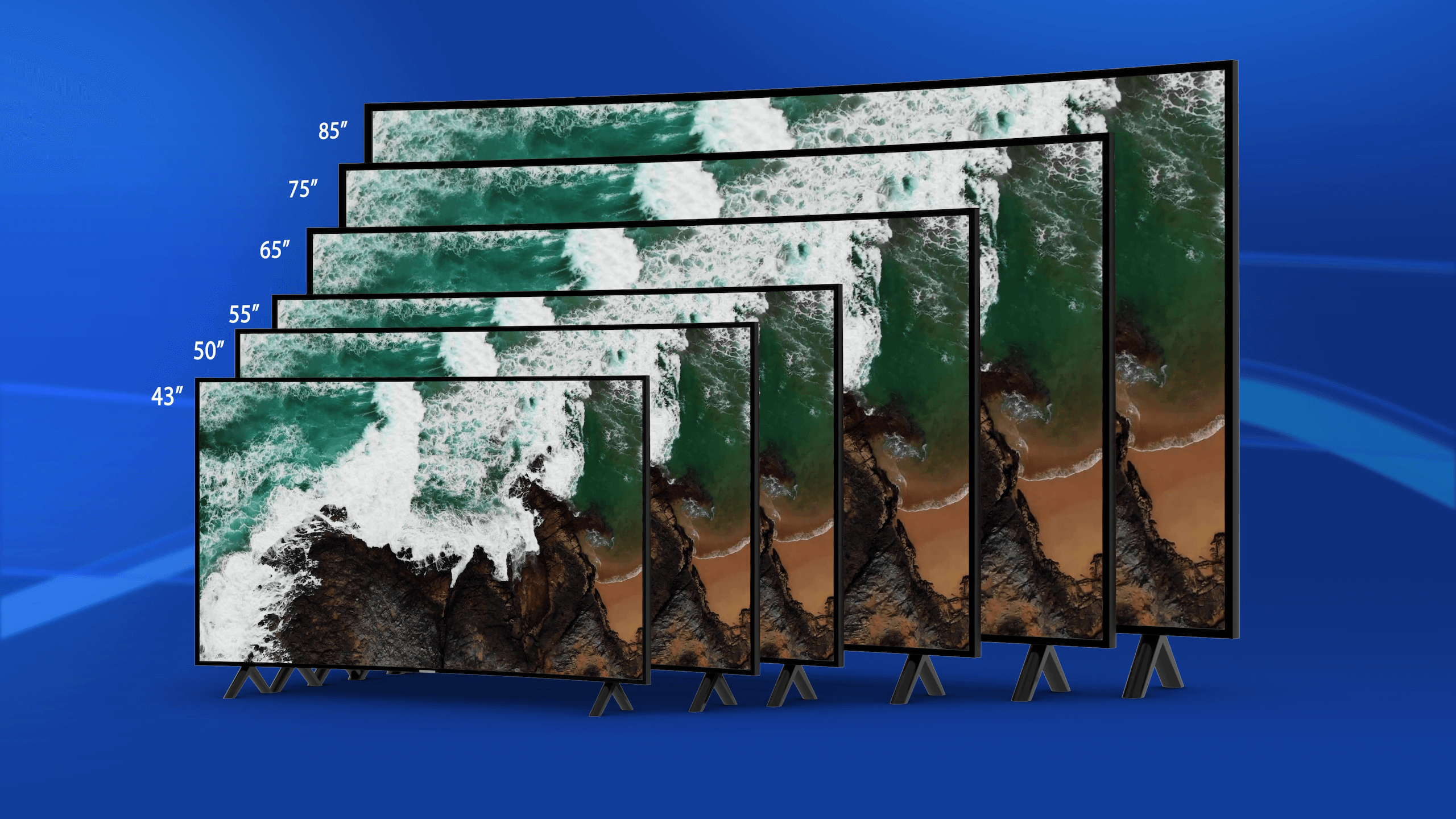 An arrangement of six flat-screen TVs of different sizes, expertly installed using TV wall mounting, is displayed against a blue background. The screens showcase an aerial view of waves crashing onto a beach, with sizes ranging from smallest to largest: 43 inches, 50 inches, 55 inches, 65 inches, 75 inches, and 85 inches.